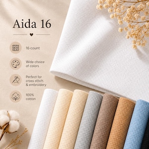 May include: White Aida 16 count cross stitch fabric with a selection of coloured fabric rolls. The image includes text that reads "Aida 16", "16 count", "Wide choice of colours", "Perfect for cross stitch & embroidery", and "100% cotton".