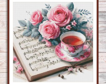 May include: A still-life image featuring a teacup and saucer with a floral design, filled with tea, resting on a book of sheet music. Pink roses and greenery are arranged around the teacup. The image is framed in a brown border.