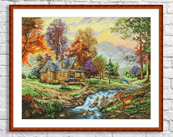May include: A cross-stitch pattern of a cozy cabin nestled in a forest setting. The cabin has a wooden exterior and a porch with a rocking chair. The forest is filled with colorful trees, a flowing stream, and a deer. The scene is bathed in warm sunlight.