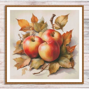 May include: Three red and yellow apples with a yellow-orange hue, nestled amongst brown and yellow autumn leaves. The apples are arranged in a cluster, with the leaves surrounding them.
