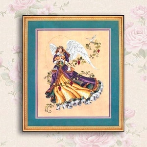 May include: A cross-stitch pattern featuring an angel with a halo, wings, and a long flowing gown. The angel is holding a small fawn in her arms. The background is a light beige with vines and grapes.