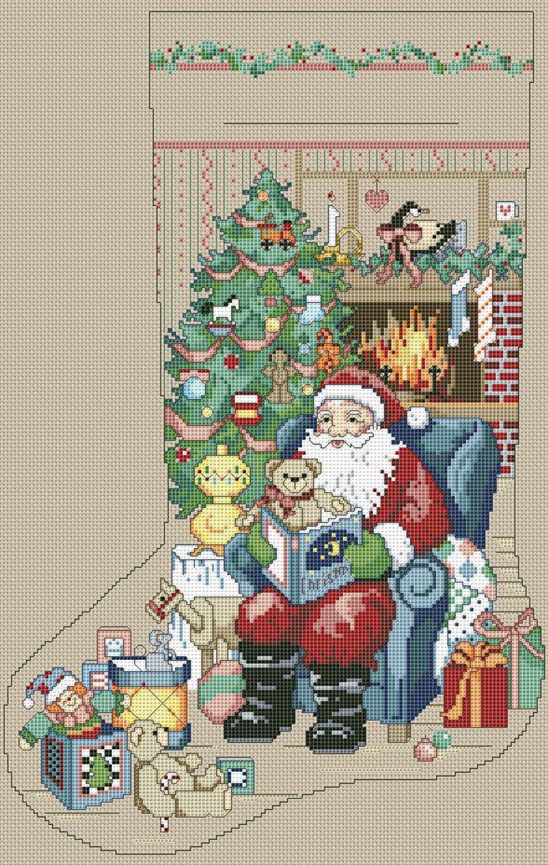 May include: Cross-stitch Christmas stocking featuring Santa Claus reading a book in a blue armchair. A decorated Christmas tree, fireplace, and gifts are in the background. The stocking is beige with a green border.
