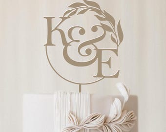 Cake topper for wedding cake: Monogram with foliage design.