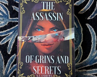 The Assassin of Grins and Secrets