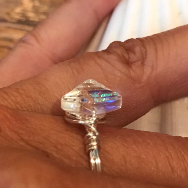 Wire wrapped clam shell glass ring
