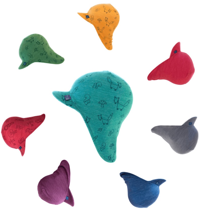 May include: Seven colorful knitted hats with a variety of patterns, including foxes, mushrooms, and squirrels. The hats are all in different colors, including green, blue, red, orange, purple, and gray.