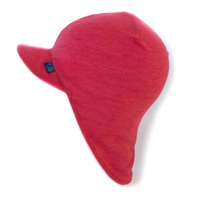 May include: Red fleece hat with a long flap that can be pulled down to cover the neck and ears. The hat has a small brim and a logo on the side that says "BUFF USA".