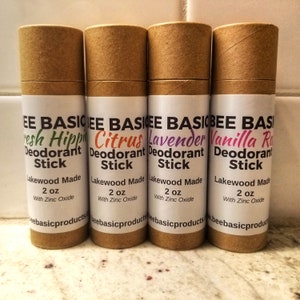 May include: Four brown cardboard tubes with white labels. Each tube contains a 2 ounce deodorant stick with a different scent: Fresh Hippie, Citrus, Lavender, and Vanilla Rose. The labels also state "Lakewood Made" and "With Zinc Oxide".