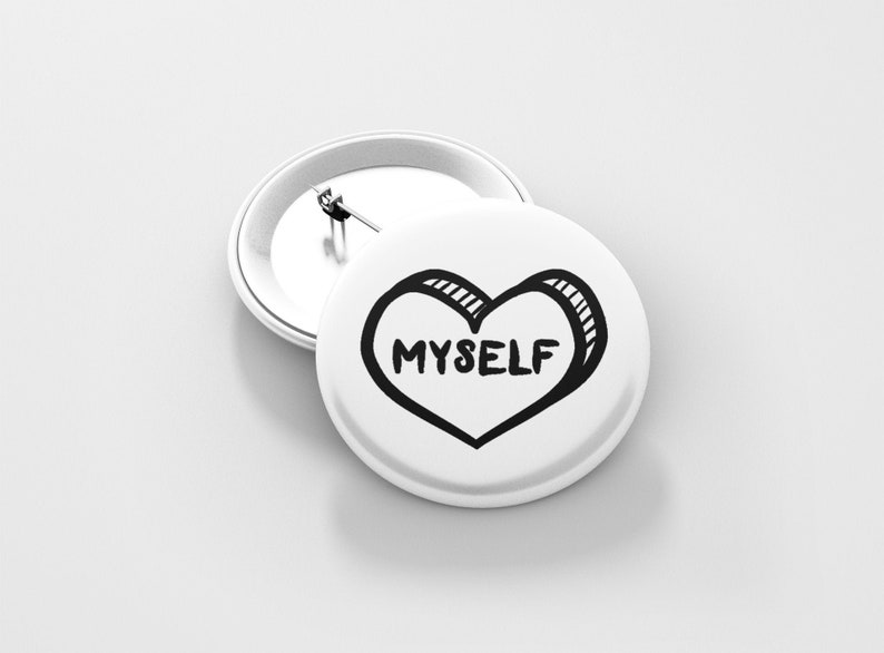 May include: White button with a black and white drawing of a heart with the word "MYSELF" inside.
