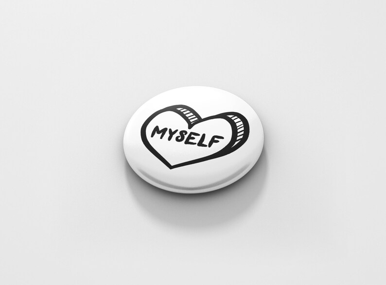 May include: White button with a black and white hand-drawn heart that says "MYSELF" inside.