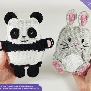 May include: Two crocheted animal-shaped items: a panda and a bunny. The panda is black and white with pink accents. The bunny is gray with pink ears and paws. The text in the image says "PATTERN" and "This is a PDF file Tutorial, not a finished Product".