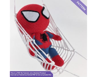 May include: A crochet pattern for a Spiderman amigurumi doll in a white web hammock. The pattern is a PDF file tutorial, not a finished product. PATTERN
