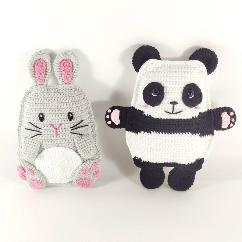 May include: Two handmade crochet stuffed animals: a gray bunny with pink accents and a black and white panda. The bunny has pink inner ears and paws. The panda has black ears, eyes, and limbs, with a white body.