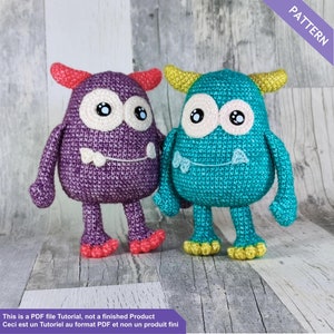May include: Two crocheted monster toys. One is purple with red horns and feet, the other is teal with yellow horns and feet. Both have large white eyes, small teeth, and small arms. The image includes the text "PATTERN" and "This is a PDF file Tutorial, not a finished Product".