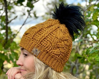 Crocheted Cable Knit Winter Hat with Faux Fur Pom