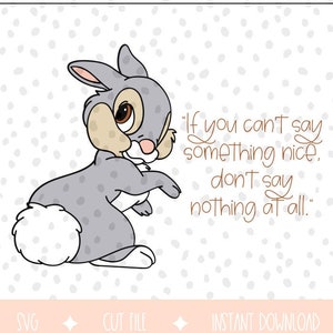 May include: A grey rabbit with a white tail sits on a white background. The rabbit is looking to the right. The quote "If you can't say something nice, don't say nothing at all." is written in brown text on the right side of the image.
