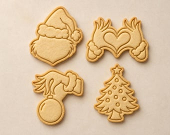 Set de sellos para galletas con personajes navideños peludos verdes: gorro de Papá Noel, manos en forma de corazón, mano con adorno y árbol.