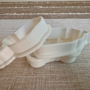 sample cookie cutters displayed on a table