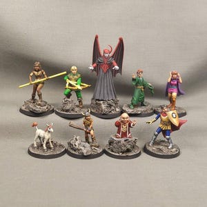 May include: A selection of hand-painted fantasy miniatures. The figures include a winged demon, archer, barbarian, wizard, and other characters. Each miniature is mounted on a textured base, with a neutral background.