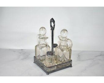 Vintage Antique Silver and glass cruet set with silver lids and a silver base for oil, vinegar, salt and pepper
