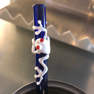 Frog Glass straws, white frog on blue glass, red eyes.