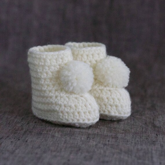 baby shoes with pom poms