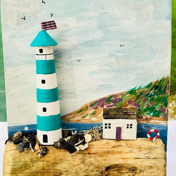 Lighthouse and hills driftwood mixed media picture