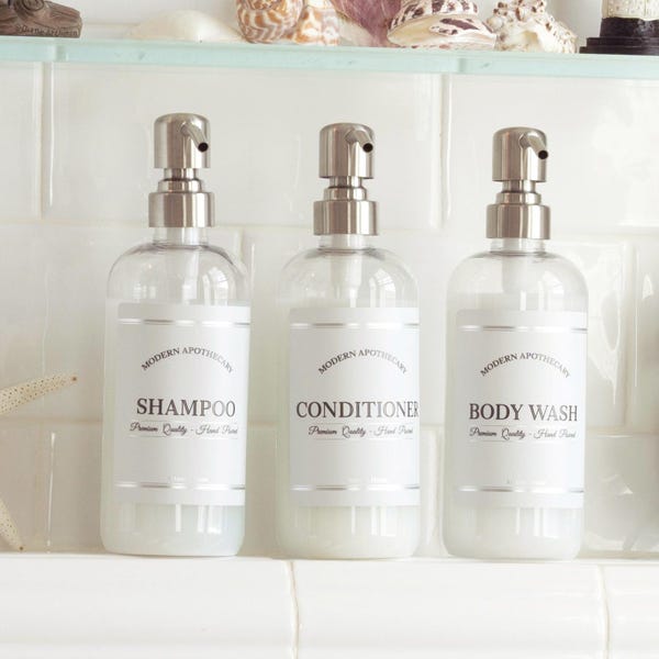 Juego de 3 botellas de plástico transparente para champú, juego de dispensadores de jabón con etiquetas impermeables, botellas con bomba para champú, acondicionador, gel de ducha y más.
