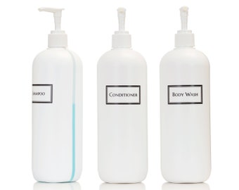 May include: Three white plastic bottles with pumps, labeled "Shampoo", "Conditioner", and "Body Wash".