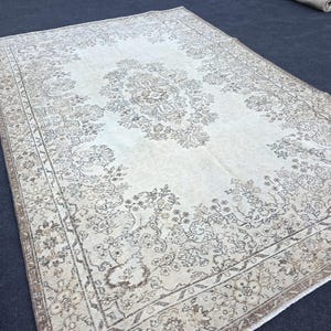 Vintage Oushak Rug: 6.4x9.2 Ft. Turkish Wool Rug, Pale Neutral Colors
