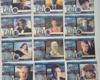 May include: A set of 12 trading cards featuring characters from the James Bond film "Die Another Day". Each card features a different character from the film, including the actors' names and their roles. The cards are in a blue and silver color scheme with the title "007 Die Another Day Casting Call" printed on each card.