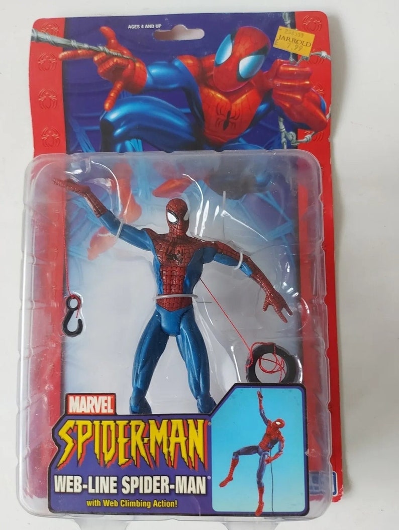 K&ouml;nnte beinhalten: Eine rote und blaue Spider-Man-Actionfigur mit Web-Schleuder-Aktion. Die Figur ist in einer durchsichtigen Plastik-Blisterverpackung mit roter und blauer Pappr&uuml;ckseite verpackt. Die Verpackung zeigt das Marvel-Logo und den Text "Spider-Man Web-Line Spider-Man with Web Climbing Action!"