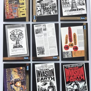 May include: A selection of vintage film posters and promotional items for the Daleks, featuring artwork and text from the Doctor Who series. Posters include "Invasion Earth" and "Daleks" with various designs and colours.