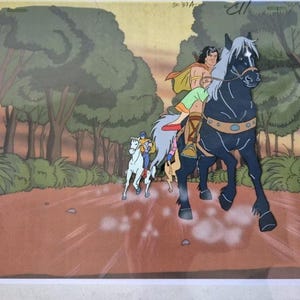 May include: An animated scene depicts a man riding a black horse, leading two others on a dirt path through a forest. The man wears a cape and colorful clothing. The horses are in motion, suggesting a journey or chase.