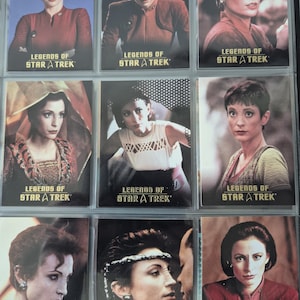 Op de afbeelding: Een verzameling van negen ruilkaarten met het personage Major Kira Nerys uit Star Trek. Elke kaart toont een ander portret van het personage in verschillende outfits en omgevingen, met de tekst Legends of Star Trek onderaan de kaarten.