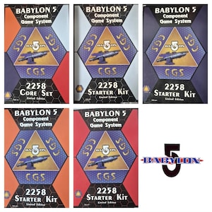 May include: Multiple boxes of the Babylon 5 Component Game System. Each box features a hexagonal design with the Babylon 5 logo, a spaceship illustration, and the text "2258 Starter Kit" or "Core Set". The boxes have a limited edition label.