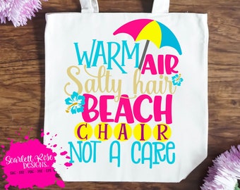May include: A white canvas tote bag with a colorful beach-themed design. The text on the bag reads "Warm Air Salty Hair Beach Chair Not A Care".