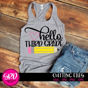 May include: A gray tank top with the text "hello third grade" in black. A pink heart and a yellow pencil with a pink eraser are above the text. The tank top is on a wooden surface.
