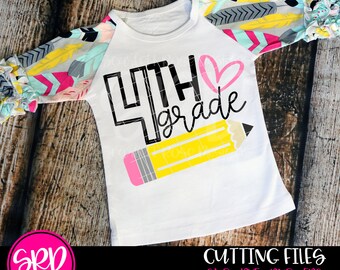 May include: A white long-sleeved shirt with a black and white design that says "4th grade" with a pink heart and a yellow pencil. The shirt has a colorful pattern on the sleeves.