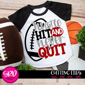 May include: A white t-shirt with a black and red graphic design of a football with the text "hustle hit and never quit".