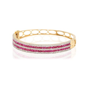 Bracciale rigido con diamanti e rubini: bracciale rigido da donna in oro 18 carati