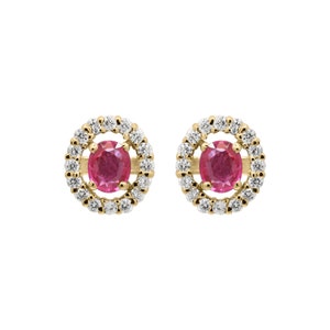 May include: A pair of gold earrings with a round ruby gemstone surrounded by a halo of smaller diamonds.