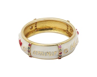 May include: A white gold ring with a white enamel band and the word "amour" inscribed in gold. The band is decorated with small red hearts, diamonds, and multi-coloured gemstones.
