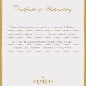 May include: Certificate of Authenticity for jewellery, stating that it is made with 9K, 14K, or 18K gold and that gemstones and diamonds are 100% natural. The certificate is from Memoria, with a phone number and email address.