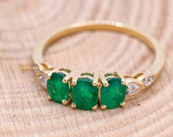 14k Yellow Gold Emerald Ring: Three Stone Diamond Accent