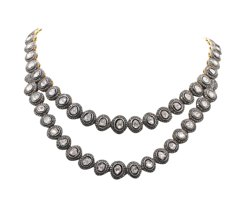 Close-up of Polki diamonds set in mixed metal gold and silver necklace, showing intricate craftsmanship