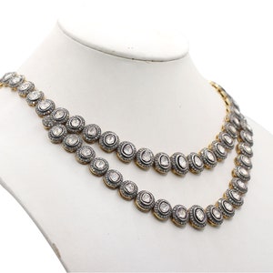 Side angle of handmade gold and 925 silver necklace highlighting unique detailing and texture