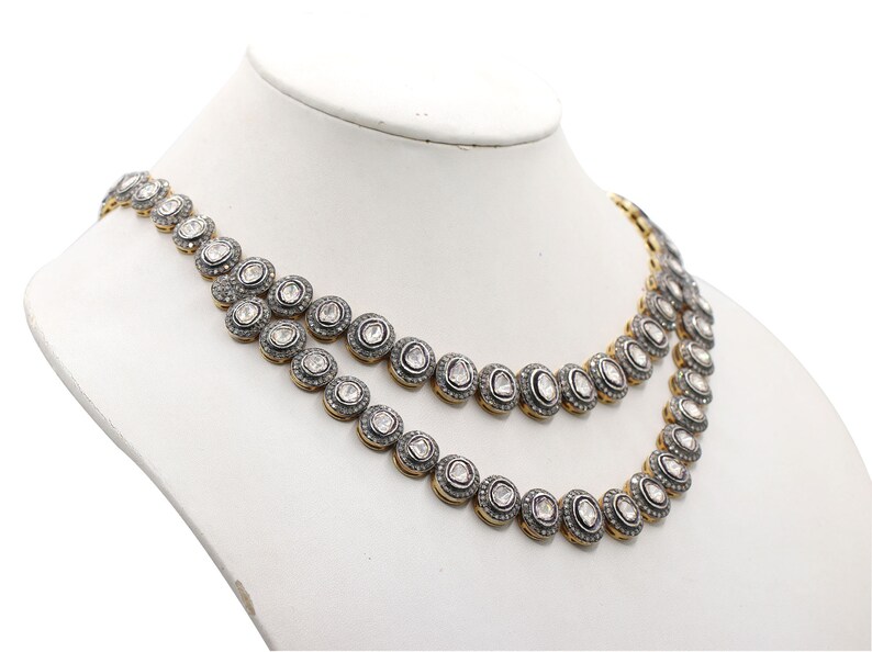 Side angle of handmade gold and 925 silver necklace highlighting unique detailing and texture