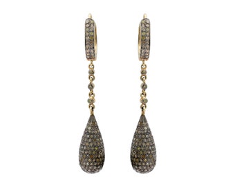 May include: A pair of gold hoop earrings with a teardrop-shaped diamond dangle. The earrings are set with pave diamonds and have a delicate chain connecting the hoop to the dangle.