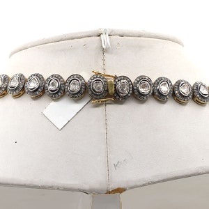 Necklace worn by model, showing drape and fit for bridal or formal occasions